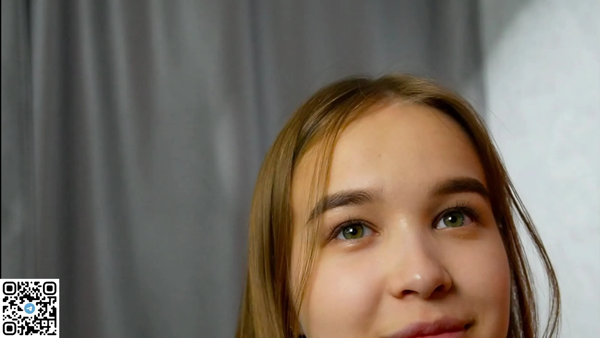 A woman's captivating eyes gaze directly at the viewer with a hint of mystery